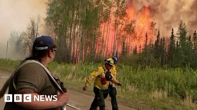 Dramatic video shows firefighters running in Alberta